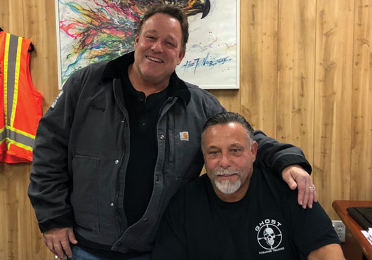 Eagle One Roofing Contractors Inc. co-owners (and brothers) Danny Sabatino (standing) and Vinny Sabatino lead the firm, which was founded in 1993 by their father.